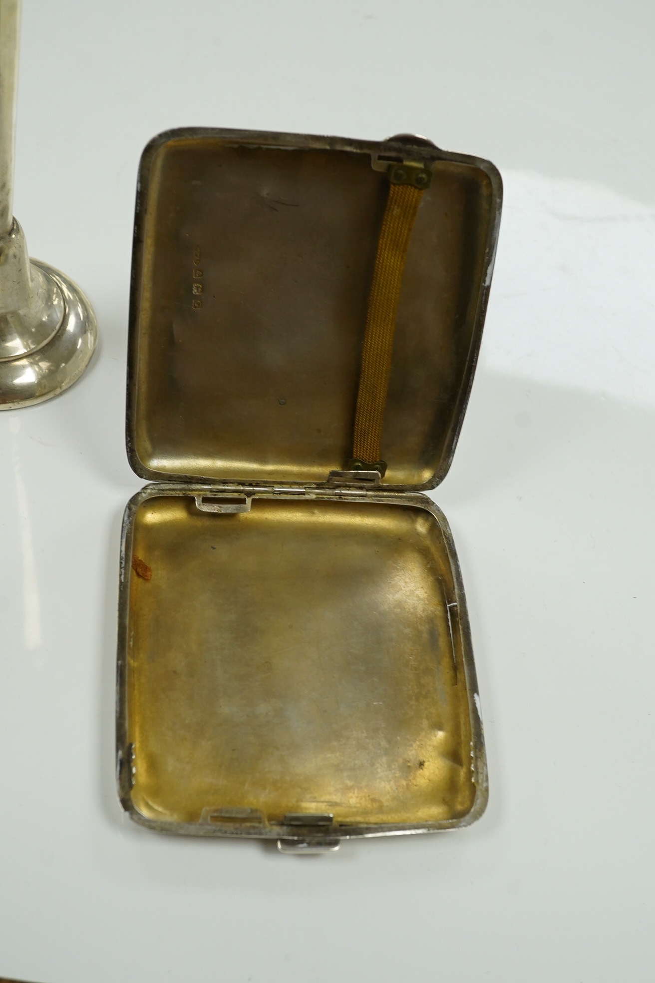 A George VI silver sauceboat, a George III drum mustard, a George V cigarette case and a loaded specimen vase, 10.5 oz of weighable silver. Condition - mustard lacks liner, vase dented, otherwise good